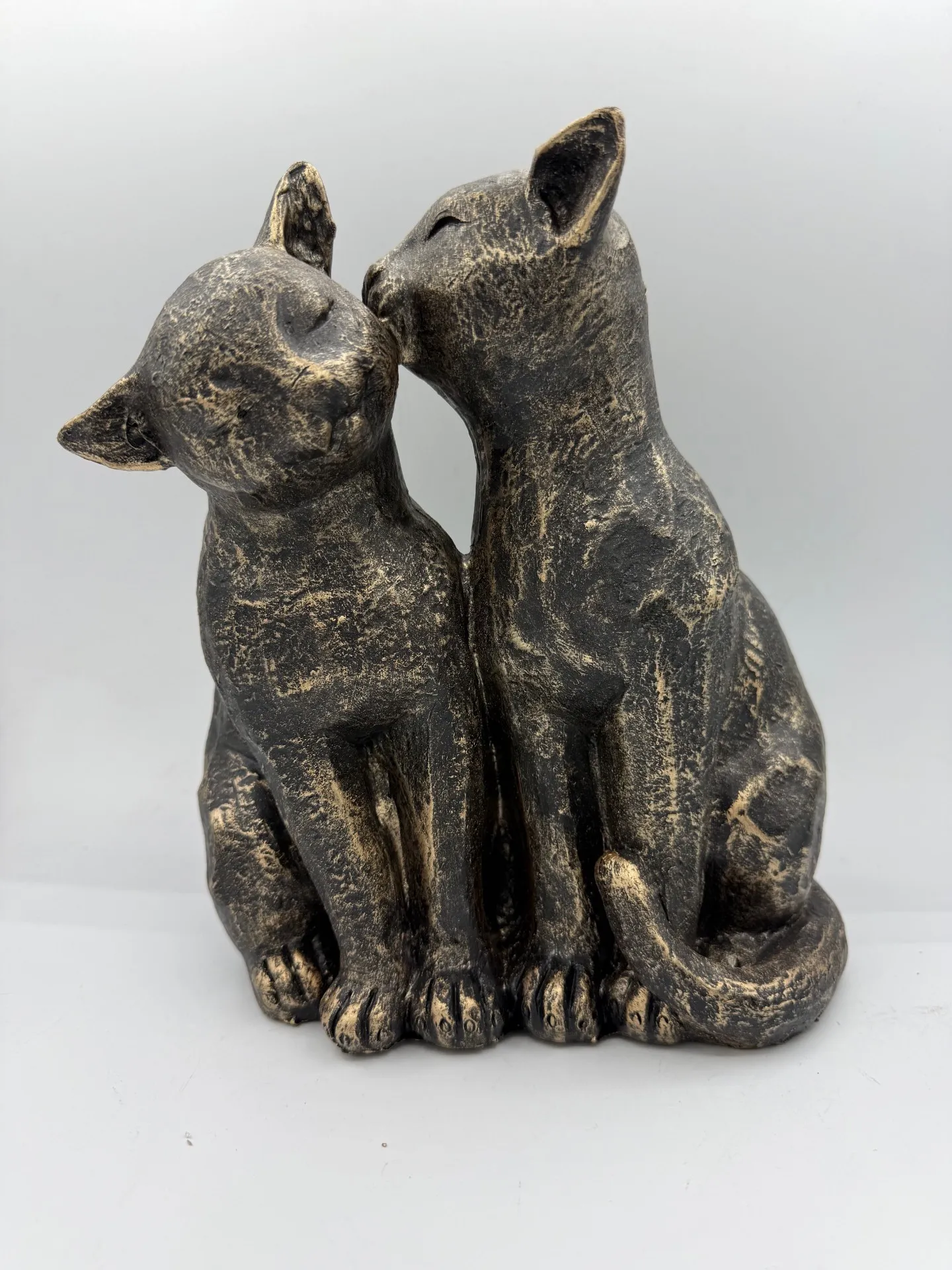 Two cats preening - bronze
